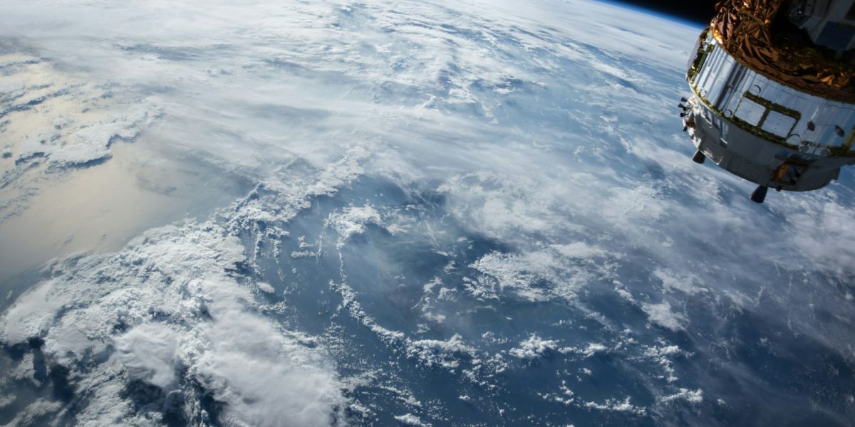 view of Earth and satellite