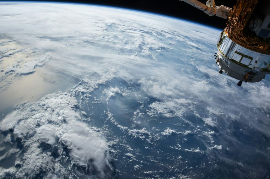 view of Earth and satellite